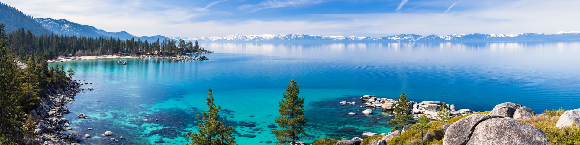 Panoramic view of Sand Harbor on Lake Tahoe's east shore with granite boulders and turquoise water