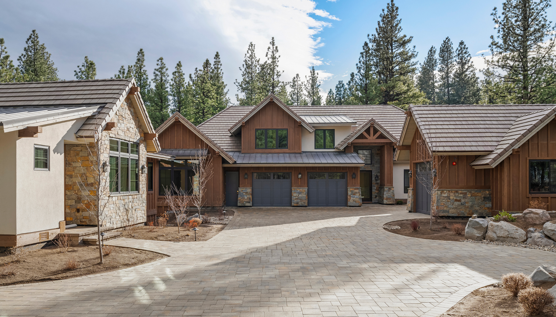 Residence II at Montreux — A timbered gable silhouette, voluminous great room, and en-suite guest quarters framed by native stone.